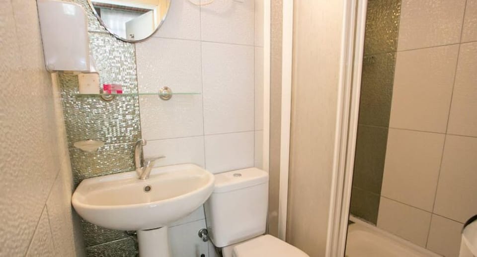 Shower, free toiletries, hair dryer, slippers