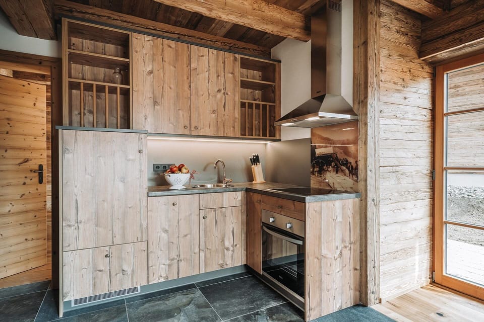 Deluxe Chalet (S`BSUNDRÈ) | Private kitchen | Full-size fridge, oven, stovetop, dishwasher