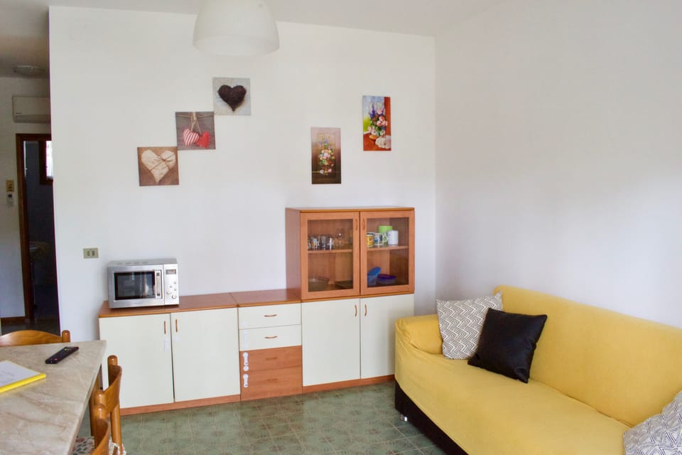 Family Apartment, 2 Bedrooms, Garden View, Beachside | Living room | Flat-screen TV