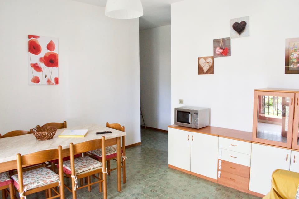 Family Apartment, 2 Bedrooms, Garden View, Beachside | Living room | Flat-screen TV