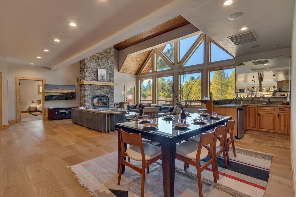- Spacious dining area opens to kitchen and living with forest views  
- Natural light fills the room for bright and welcoming meals  
- Seamless flow between spaces ideal for group gatherings