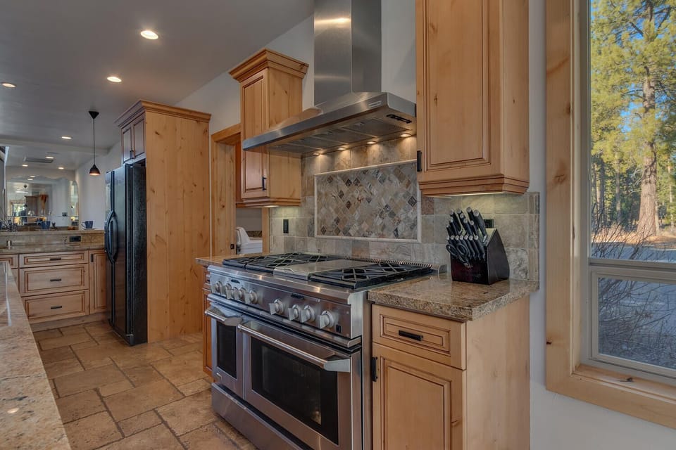 - Fully equipped kitchen with premium stainless steel appliances  
- Granite countertops and custom cabinetry for easy meal prep  
- Perfect space to cook and gather with family and friends
