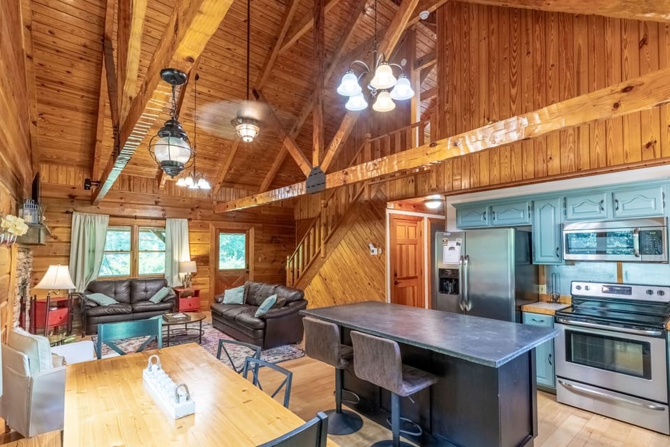 Kitchen, Dining, and Living - Full kitchen, dining room table, and living area