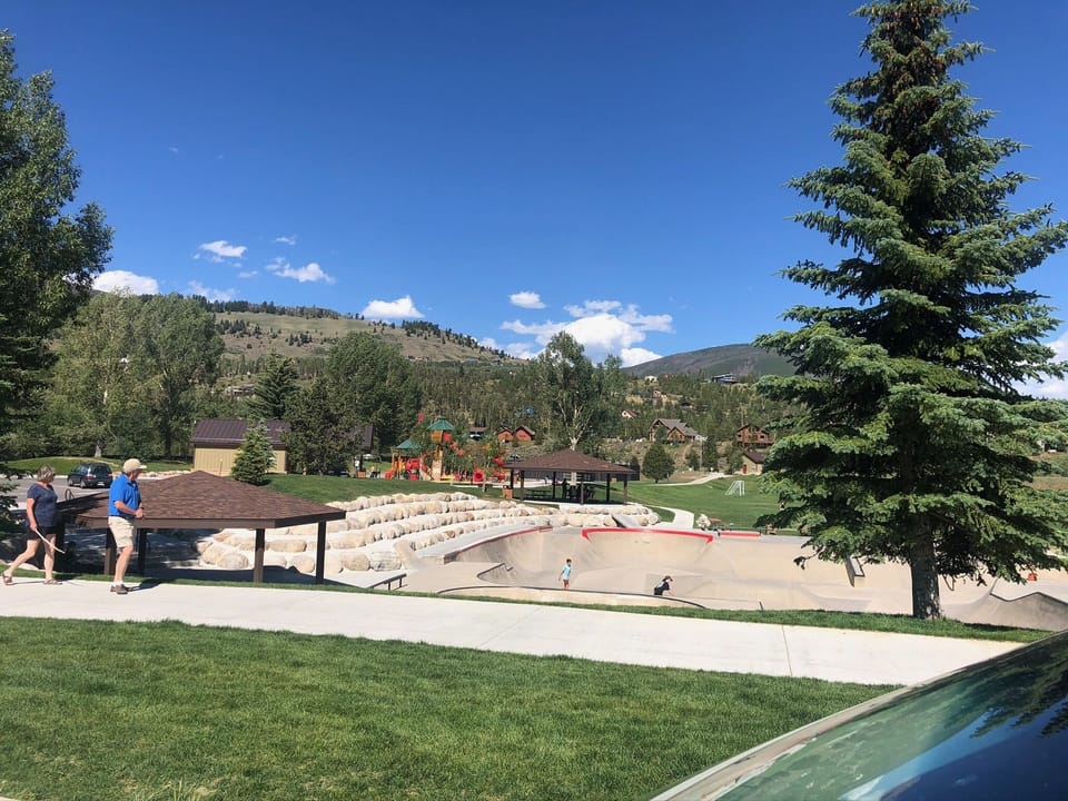 Rec center with skate ring, tennis courts and volleyball outside.