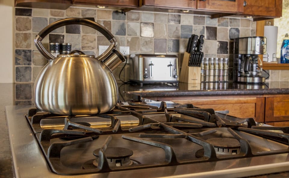 Gas cook top with built-in oven and microwave.