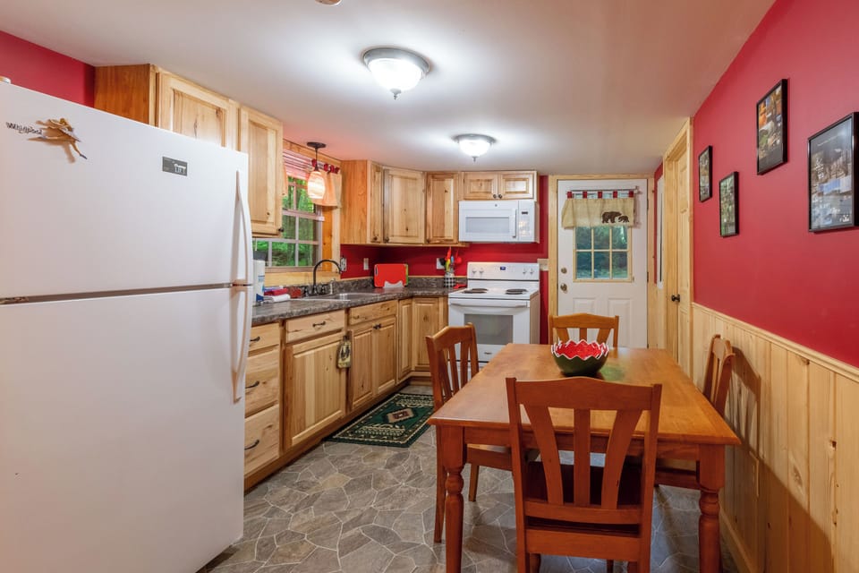Kitchen - Main level - Kitchen. Through the white door you can get to the hot tub. The bathroom door is the one on the right.