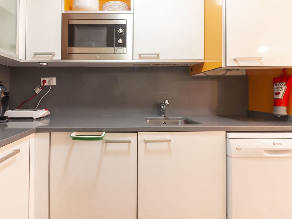 Countertop, Kitchen, Cabinetry, Room, Property, Furniture, Sink, Orange, Interior Design, Major Appliance