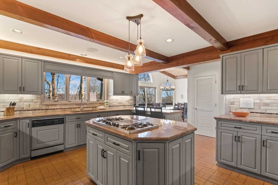 Gather to Prepare an Awesome Home-Cooked Meal in the Large Kitchen Featuring Heated Brick Floors!