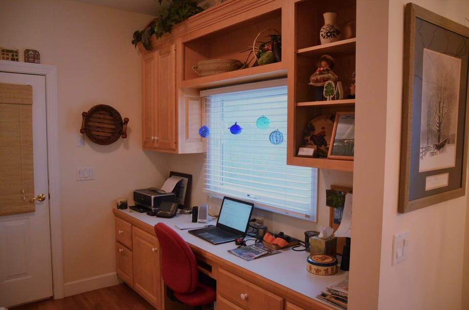 Computer workstation adjoins Kitchen and Breakfast Nook.