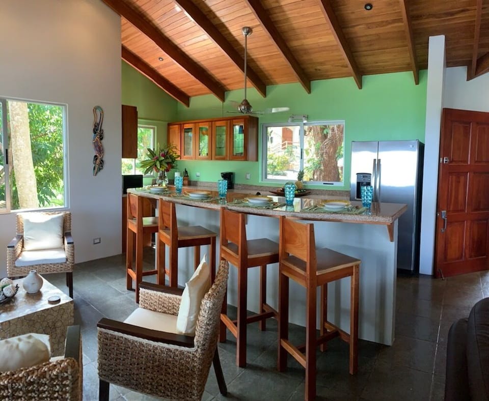 Four person bar stools in the kitchen. Wood ceilings throughout the home