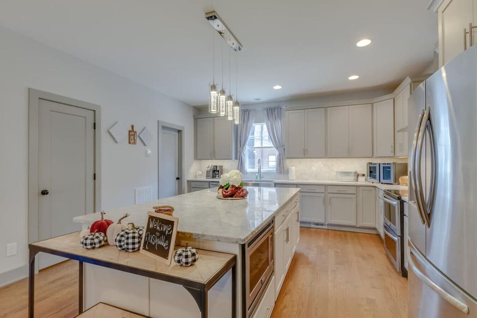 Kitchen from alternate angle showing full layout and appliances
