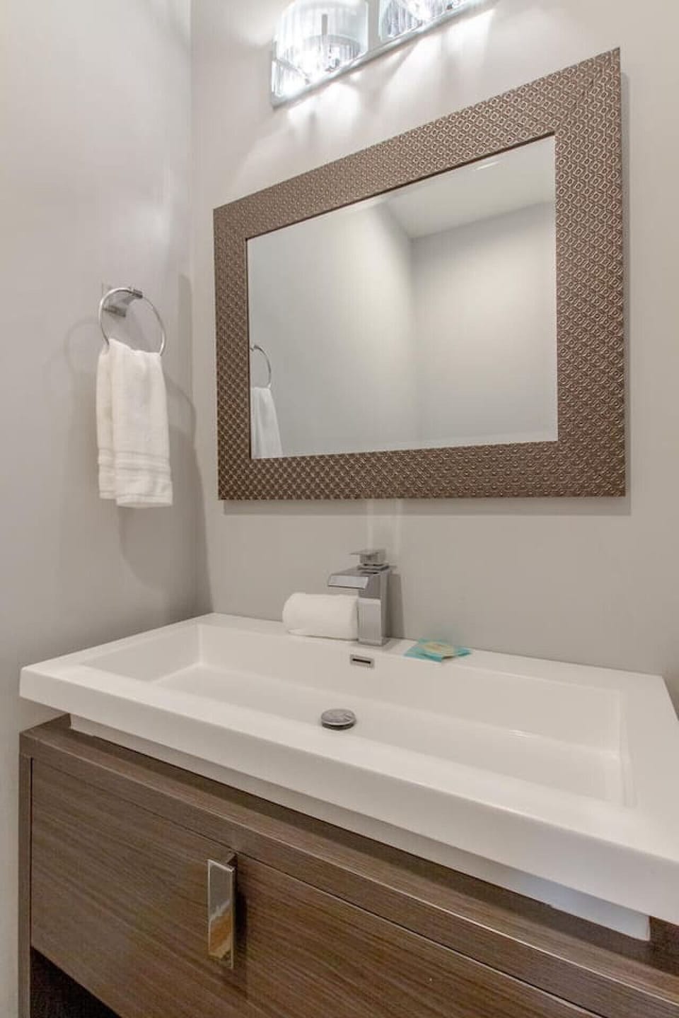 Bathroom with clean white tile and modern fixtures