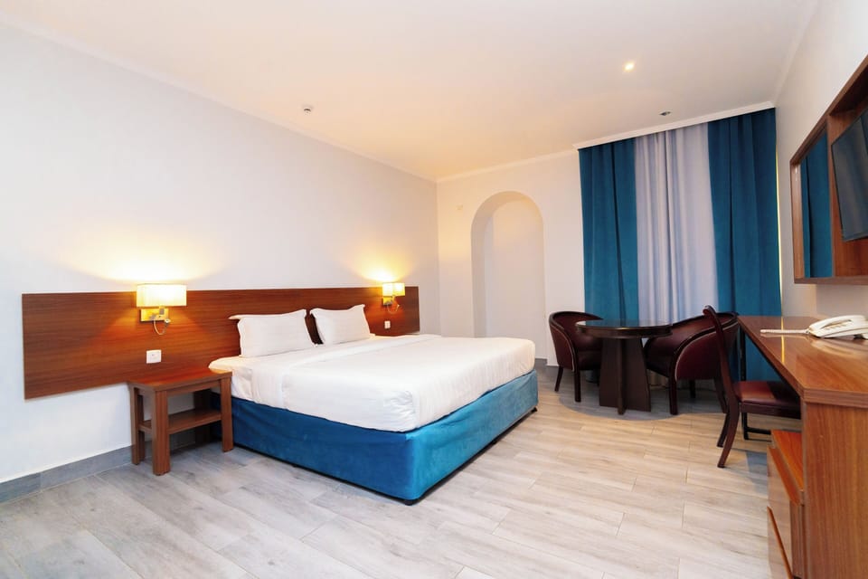 Deluxe Double Room | Desk, blackout drapes, iron/ironing board, free WiFi