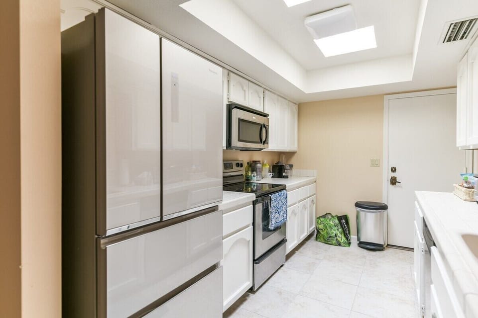 Stainless Appliances Bright Kitchen
All cabinets through out home have been updated to white.