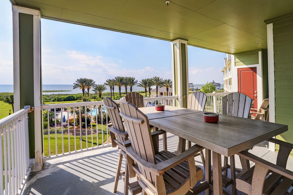 Outside seating looks toward the pool area and Galveston Bay.