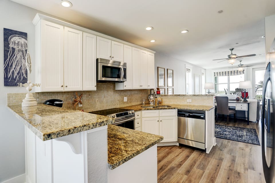 Full size kitchen has plenty of room to prep your meals and enjoy your company.