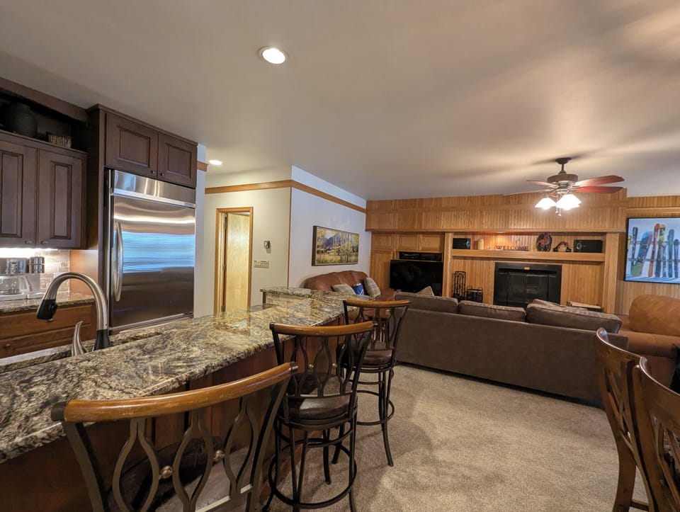 Gather around the granite breakfast bar for morning coffee