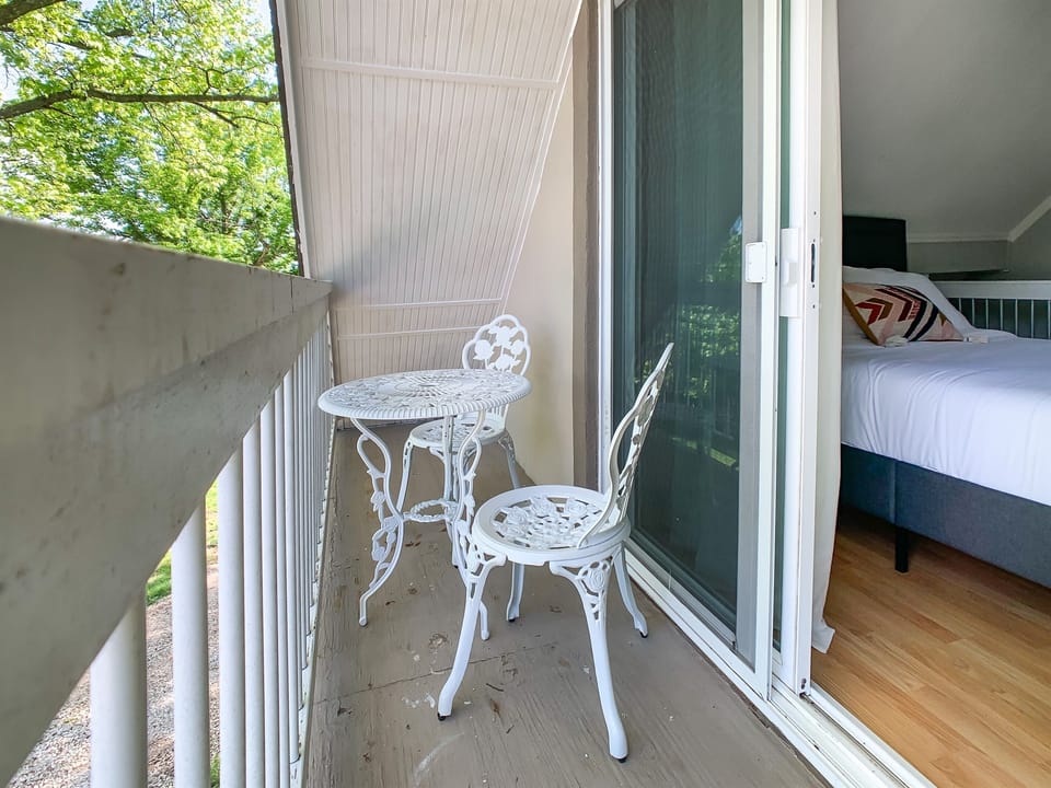 Cozy private balcony off of upstairs bedroom, great for your morning coffee or your evening unwind.