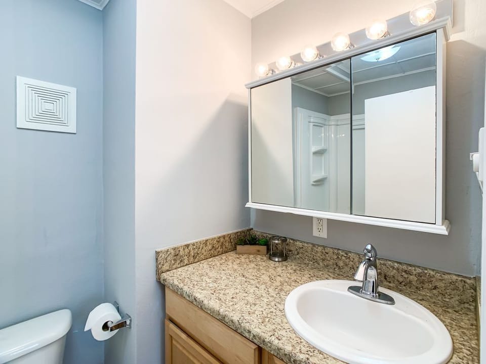 Modern full bathroom with a low-entry shower designed for easy access.