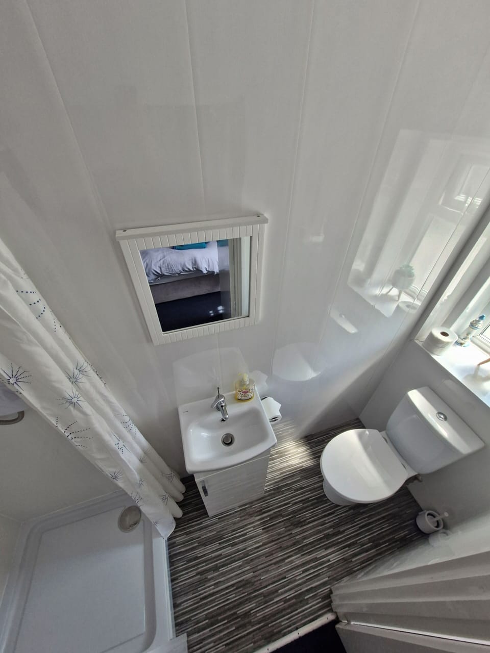 Shower, hair dryer, towels, toilet paper
