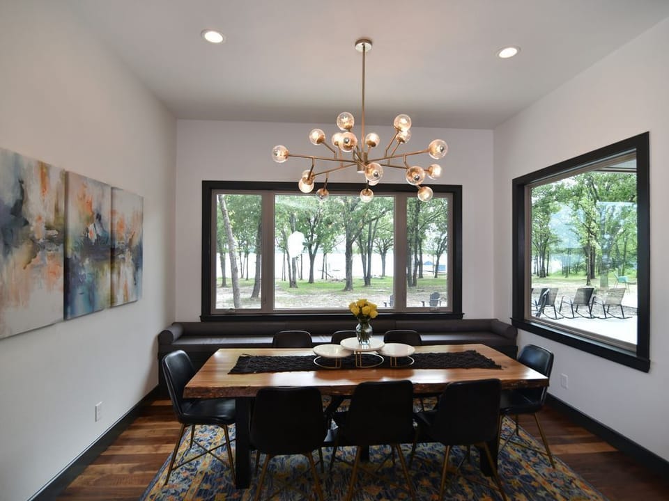 Dining room with large oak table and space for 8 w/ amazing views of lake!