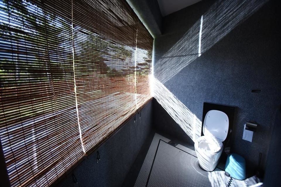 Twin Room | Bathroom | Shower, hair dryer, slippers, towels