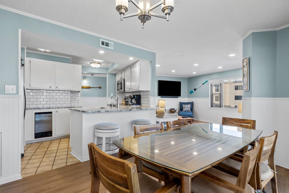 Dining area flows easily from kitchen, oceanfront balcony, and living room.