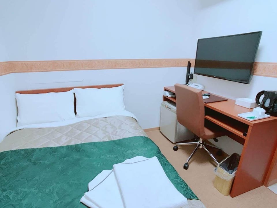Down comforters, desk, laptop workspace, blackout drapes
