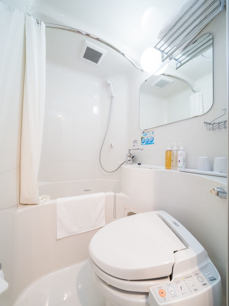 Combined shower/tub, free toiletries, hair dryer, slippers