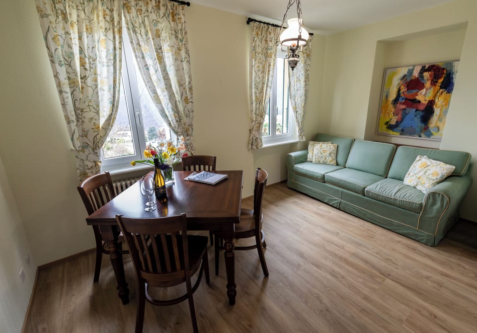 Family Apartment, 2 Bedrooms, Mountain View | Living area | 32-inch flat-screen TV with cable channels