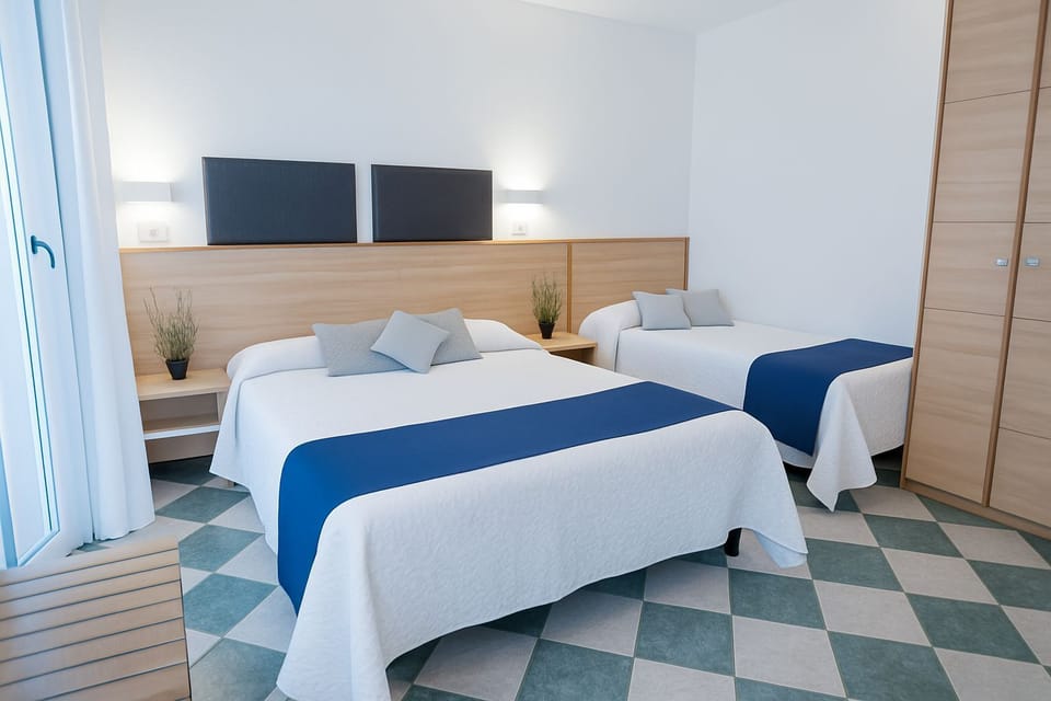 Quadruple Room | Minibar, in-room safe, desk, laptop workspace