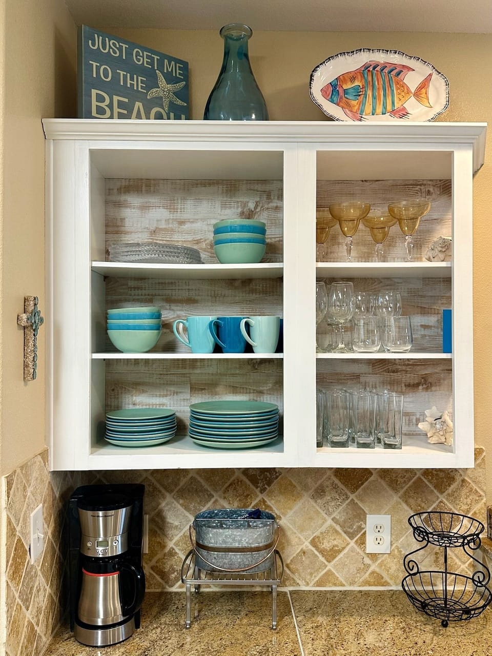 There are plenty of plates, bowls, coffee cups, glasses, and wine glasses.