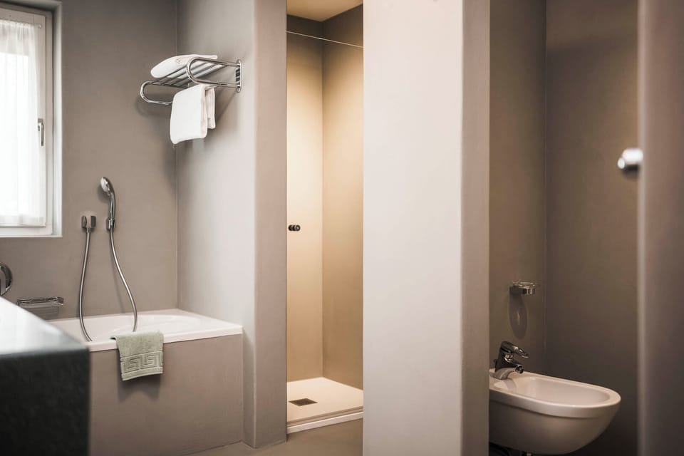 Suite | Bathroom | Hair dryer, slippers, bidet