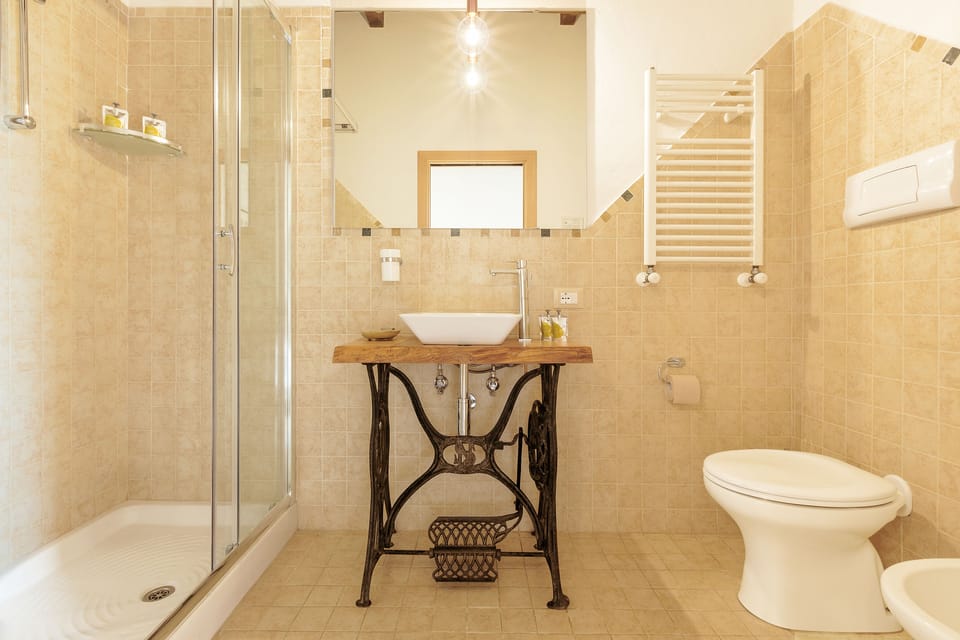 Superior Room | Bathroom | Shower, hair dryer, towels, soap