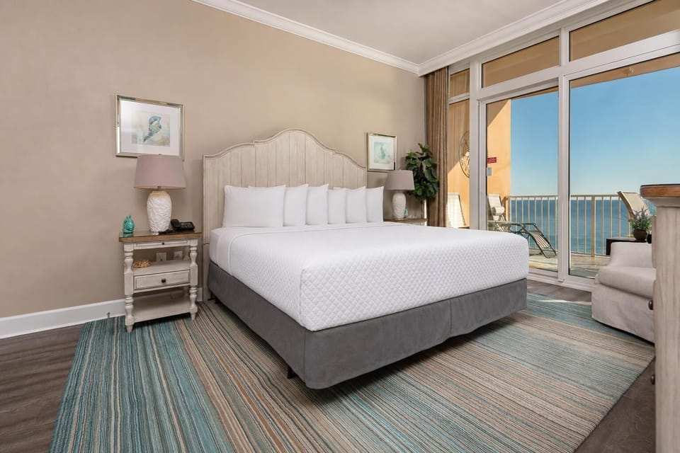 Unwind in this inviting king master suite, where fresh breezes and gentle sounds beckon from the coast