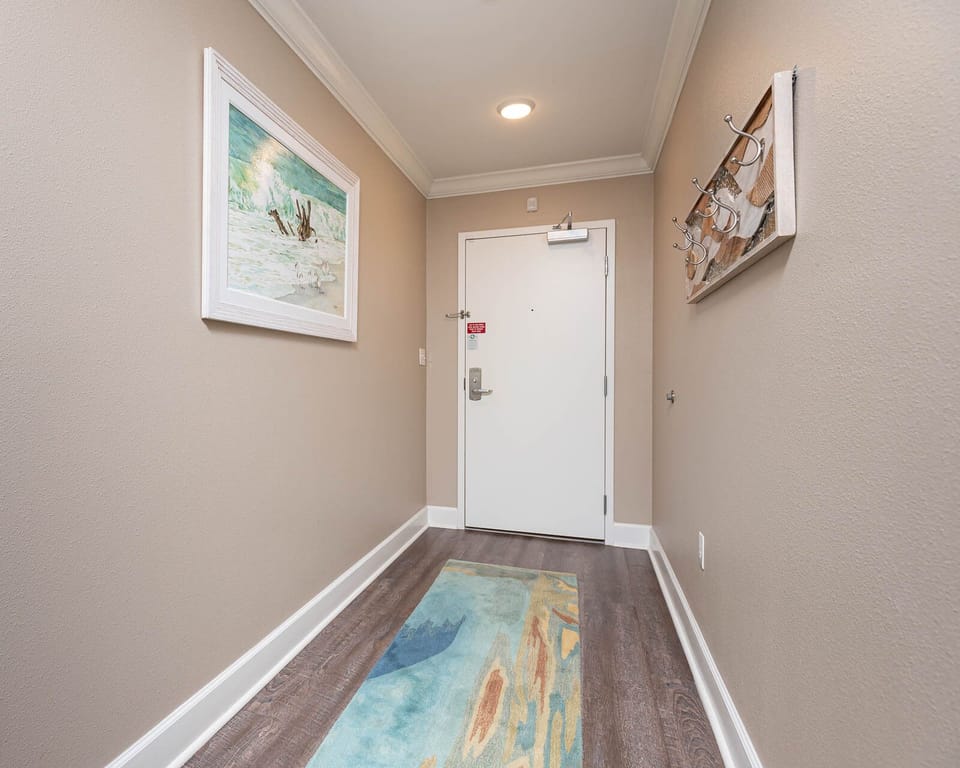 Step into a warm welcome with coastal art, setting the tone for your beach getaway