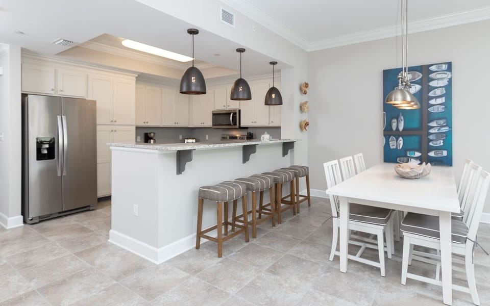 Sip your morning coffee at the breakfast bar and get ready for a beach day in this stylish space