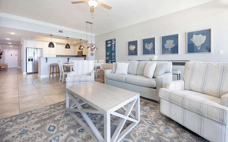 Relax in the spacious living area, where natural light fills the room while you enjoy cozy conversations