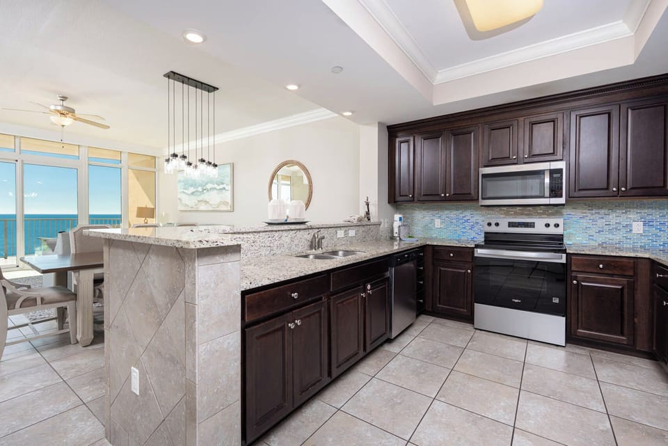 Create memorable meals in this elegant kitchen with rich cabinetry, stainless appliances, and a stylish backsplash