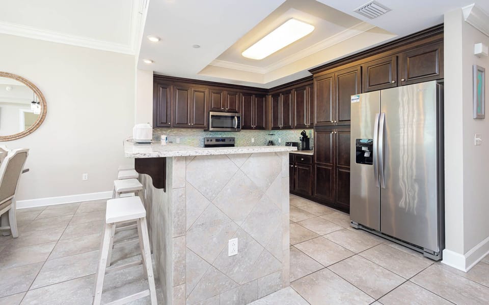 Enjoy casual conversations at the breakfast bar while savoring the aromas of your culinary creations