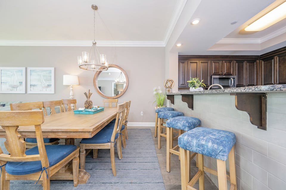 Sip your morning coffee at the breakfast bar and get ready for a beach day in this stylish space