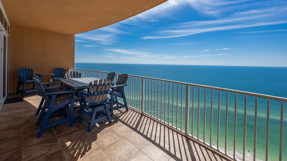 Watch the coastline stretch into the distance and the horizon meet the sky from your balcony while you soak up the sun
