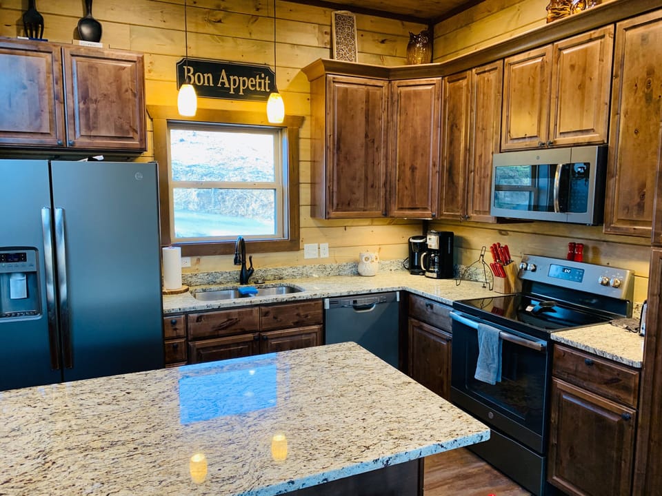 Fully stocked kitchen with regular and Keurig coffee maker. 