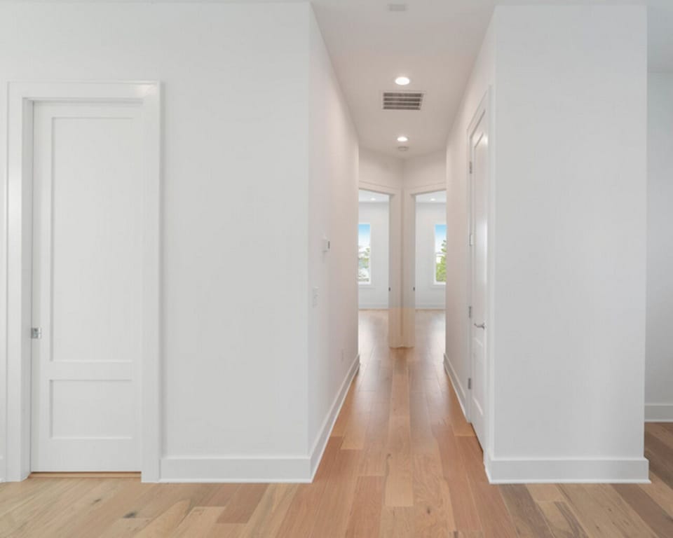 Hallway leading to 2 additional bedrooms.