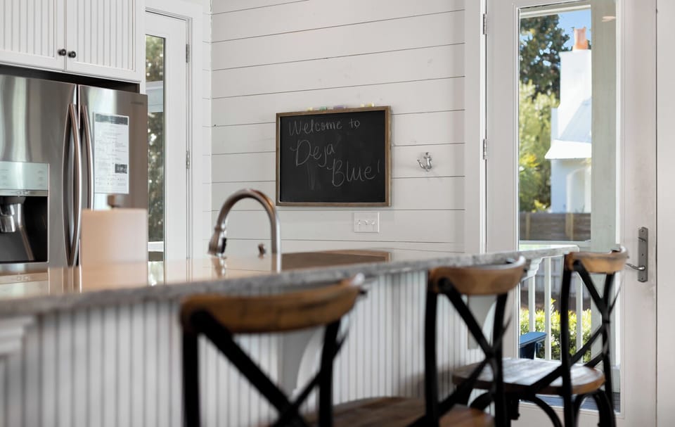Your bright kitchen welcomes you with modern appliances, granite counters, and charming farmhouse touches for comfortable meal prep.