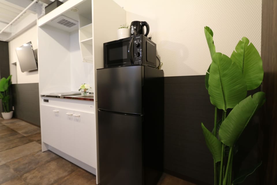 Superior Room | Private kitchen | Fridge, microwave, stovetop, cookware/dishes/utensils