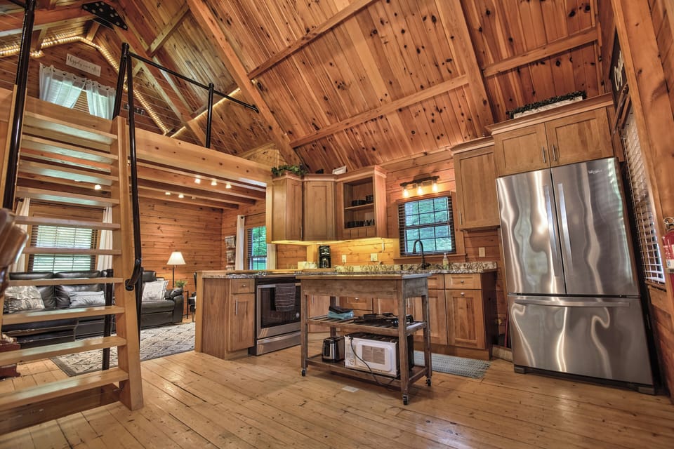 Smell the fresh wood of this cabin in this beautiful fully-stocked kitchen!