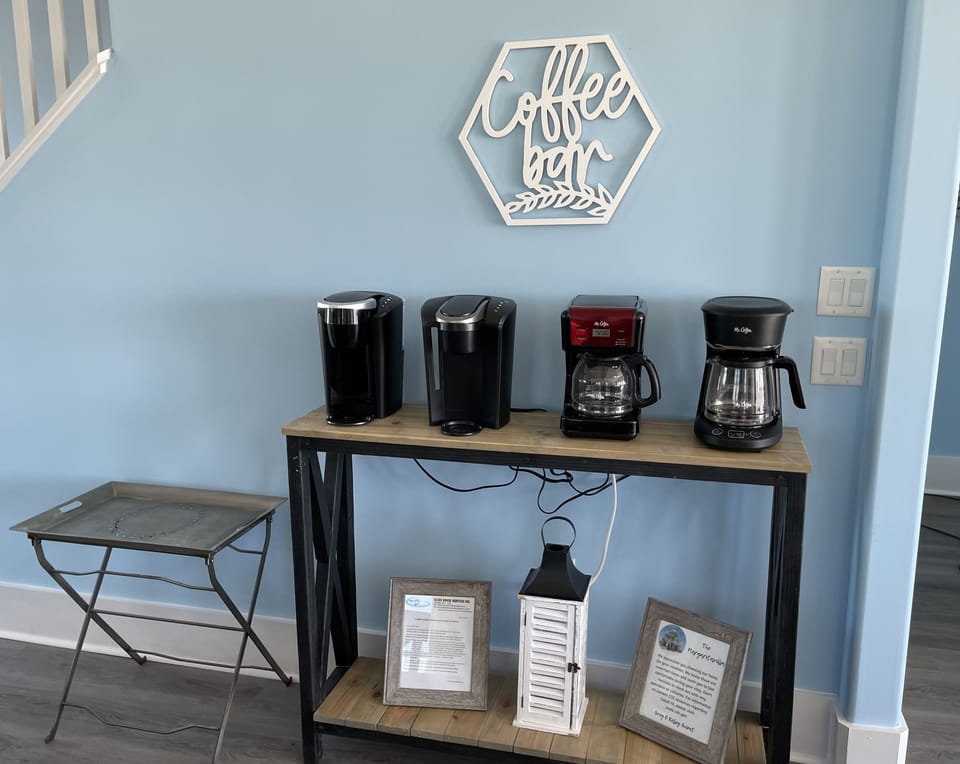 Coffe bar equipped with 4 coffee pots. 2 Keurigs and 2 Caraffes 