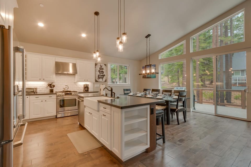 - Modern kitchen with large island  
- Stainless appliances and bright space  
- Airbnb home with chef style cooking