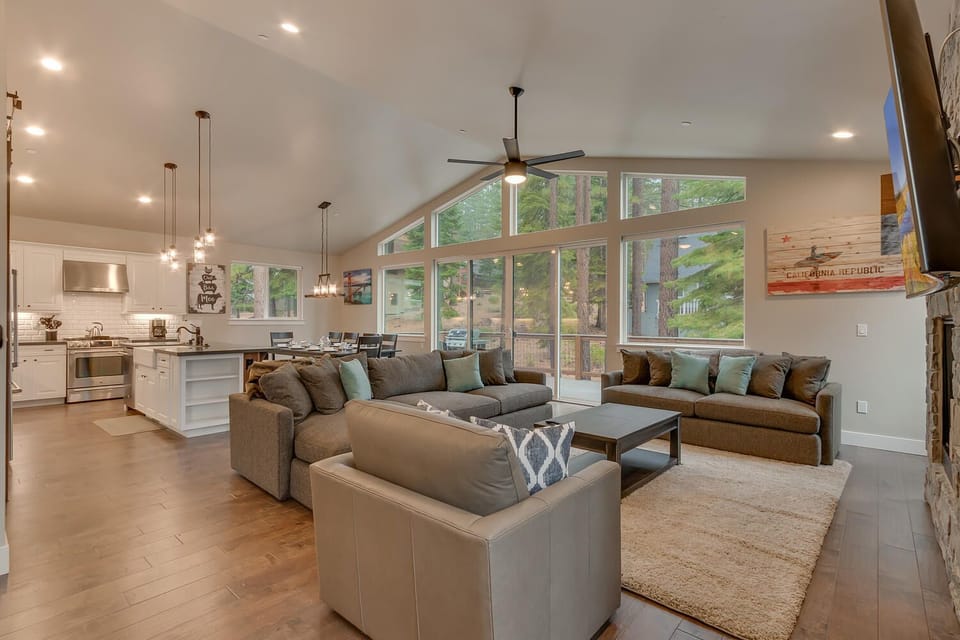 - Spacious open living area  
- Large windows with forest views  
- Family cabin with modern comfort